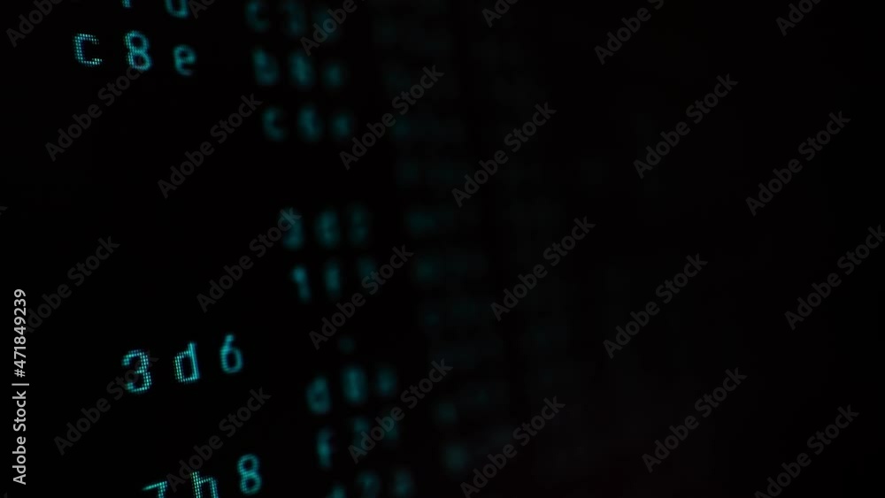 Poster close up background of a hacker monitor with programming code. macro video of a binary code flowing.
