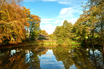 Fototapeta na wymiar Small lake in autumn scenery