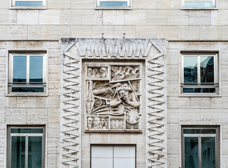 High relief in the façade of a building in piazza Affari, beside the Milan Stock exchange, Milan, Lombardy, northern Italy