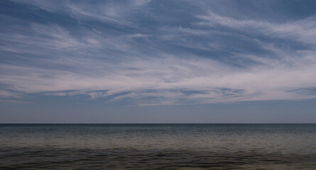 Beautiful smooth ocean landscape and sky with clouds. plenty of water. Relax
