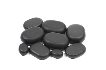 black spa stones isolated on white background .