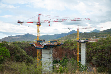 Bridge construction site with crane.