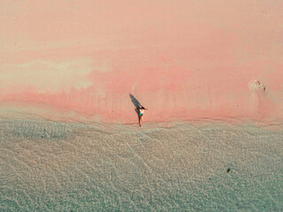 Enjoying the calming sea on the top of pink sands at Long Pink Beach