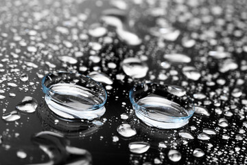 contact lenses on dark background close up view - Image