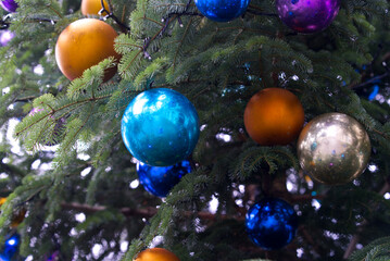 Fototapeta na wymiar Close-up of Christmas tree with colorful Christmas baubles at famous Parade Square at City of Zürich on a rainy autumn day. Photo taken November 28th, 2021, Zurich, Switzerland.