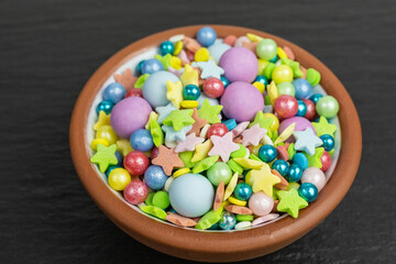 colorful sugar sprinkles in different sizes with stars and balls