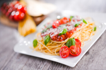 Composition with a plate of spaghetti bolognese