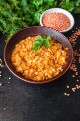 red lentils food stewed legumes spices ready to eat meal snack on the table copy space food background