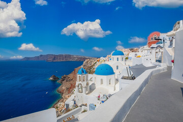 Amazing panoramic landscape, luxury travel vacation. Oia town on Santorini island, Greece. Traditional and famous houses and churches with blue domes over the Caldera, Aegean sea. Destination scenic