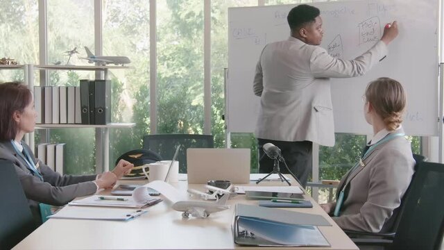 Airline business air hostess and captain aviator in uniform meeting discussion on flight business and training service of stewardess to understand yearly income and promotion
