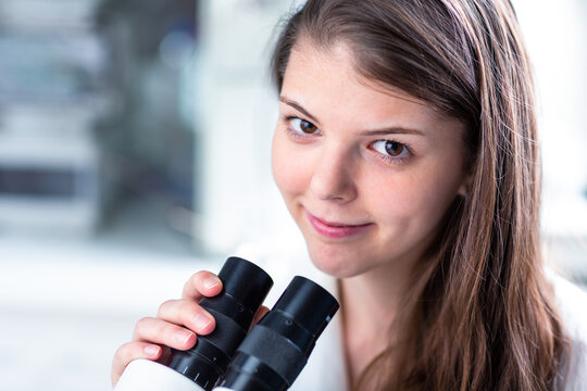 Portrait of a female chemistry student carrying out research in a chemistry lab (color toned image; shallow DOF)