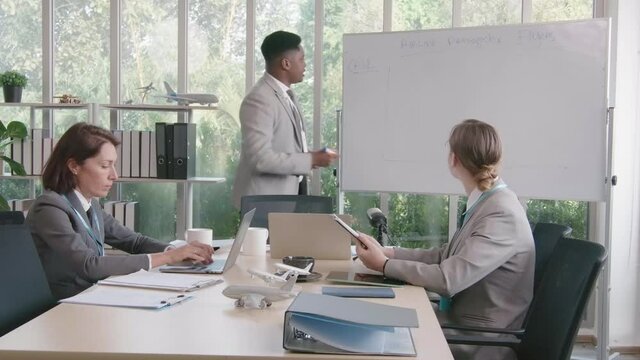 Airline business air hostess and captain aviator in uniform meeting discussion on flight business and training service of stewardess to understand yearly income and promotion
