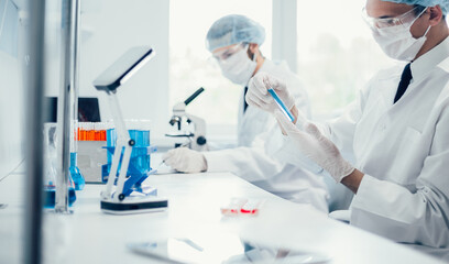 background image scientists are conducting research in the laboratory.