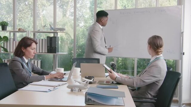Airline business air hostess and captain aviator in uniform meeting discussion on flight business and training service of stewardess to understand yearly income and promotion
