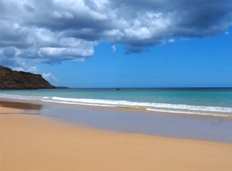 Cloudy Burgau beach in the Algarve region of Portugal