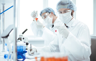 close up. group of laboratory technicians conduct testing in the laboratory .