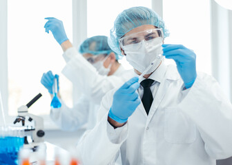 background image of a laboratory assistant in a medical laboratory