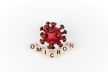 Model of corona virus with the word omicron as symbol for the new covid-19 mutant virus from south...