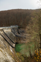 General view of the Irabia dam. Almost all of its gates are closed. The leafy trees of the Irati forest frame the image, ORBAITZETA,Navarra, Spain
