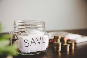 Coins in glass jar for money saving