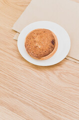 white plate with delicious organic vegan almond pie on a wooden background