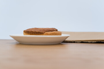 white plate with delicious organic vegan almond pie on a wooden background