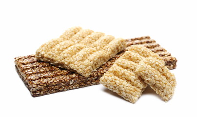 Sesame bar, pieces with chocolate isolated on white background