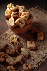 Dried figs in an old woodew dish.