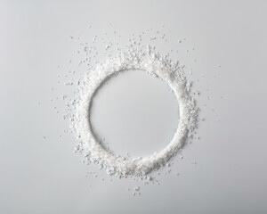 Salt is scattered on a white background.