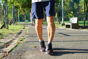 senile man legs running in the park (soft focus). concept advertising, magazine for elderly people health