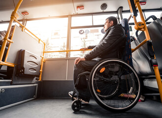 Person with a physical disability inside public transport with an accessible ramp.