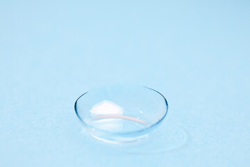 contact lenses on blue backgroundn close up view  - Image