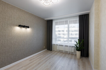 Small room after renovation, and unfurnished, interior with a large window