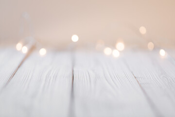 white abstract bokeh background behind wooden desk - Image
