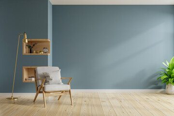 Living room interior with armchair on empty dark blue wall background.
