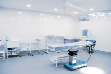 Empty interior operating room and modern equipment in hospital. Medical device for surgeon surgical emergency patient in blue tone style. Save life medical treatment concept