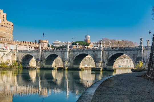 A view of Ponte Sant'Angelo (Bridge of Hadrian) on Tiber river in front of Castel Sant'Angelo (Castle of the Holy Angel)  in Parco Adriano, Rome, Italy