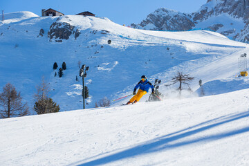 Alpine skier on slope at Cortina
