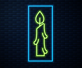 Glowing neon line Burning candle icon isolated on brick wall background. Cylindrical candle stick with burning flame. Vector