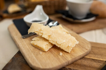 Tasting of different matured and old parmesan Parmigiano-Reggiano hard cheese in Parma, Emilia Romagna, Italy