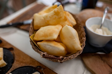 Food of Emilia Romagna region, deep fried bread gnocco fritto or crescentina served in restaurant in Parma, Italy