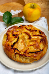 Baked apple cake with almond frangipani custard close up