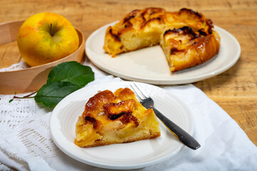 Baked apple cake with almond frangipani custard close up