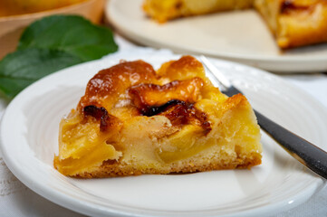 Baked apple cake with almond frangipani custard close up