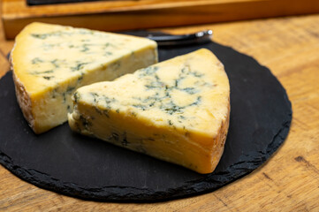 British cheeses collection, blue Stilton, Scottish coloured and English matured cheddar cheeses