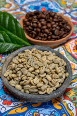 Green and roasted coffee beans from South America coffee producing region, from Colombia and Brazil with  mountain ranges and climate ideal for coffee growing