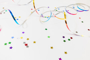 Colorful confetti on white background text place .