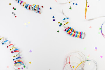 Colorful confetti on white background text place .