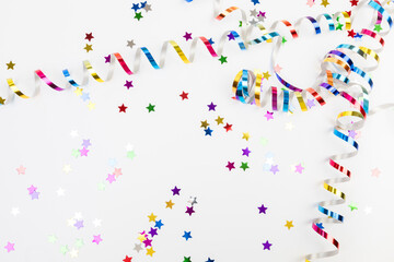 Colorful confetti on white background text place .