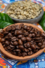 Green and roasted coffee beans from South America coffee producing region, from Colombia and Brazil with  mountain ranges and climate ideal for coffee growing